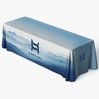 Custom printed trade show tablecloth with company logo and mountain landscape design on blue fabric